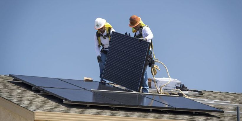 workers-installing-solar-panels