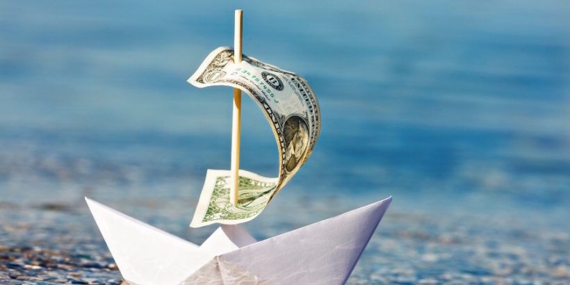 paper-boat-with-dollar-bill-for-sail