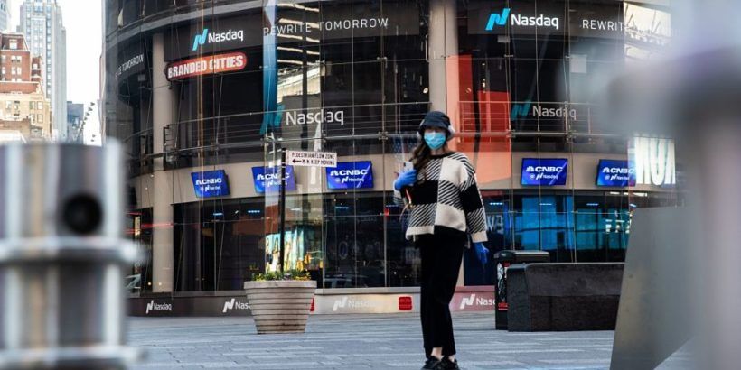pedestrian-in-mask-outside-Nasdaq-bldg